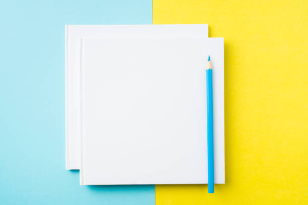 istock two white square notebook on yellow and blue paper 1132183047