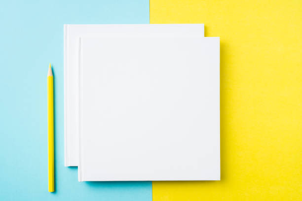 istock two white square notebook on yellow and blue paper 1132183053