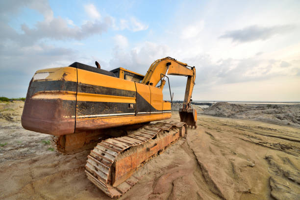 istock Large excavator under the blue sky white cloud features of artistic expression 1132183563