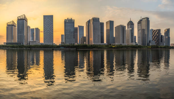 istock Modern buildings near water at dusk 1132185271