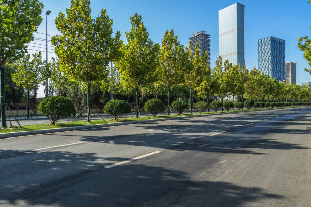 istock city empty traffic road with cityscape in background 1132185318