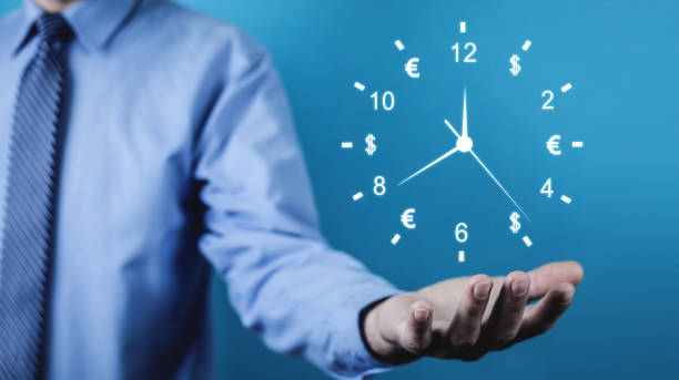 istock Man holding clock. Time is money. Business time management 1132186856