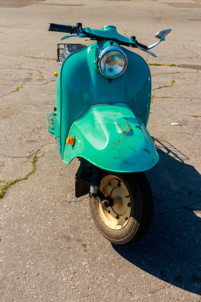 istock Blue retro scooter parked on city street 1132186908