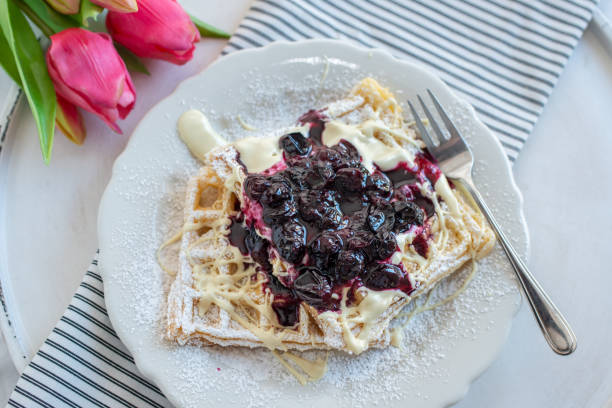 Waffles with blueberries Waffles with blueberries amerikanische heidelbeere stock pictures, royalty-free photos & images