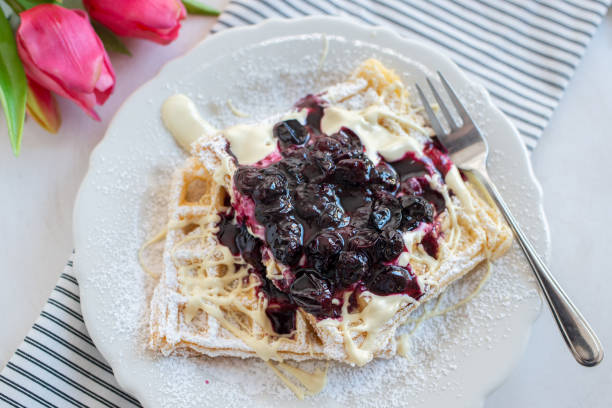 Waffles with blueberries Waffles with blueberries amerikanische heidelbeere stock pictures, royalty-free photos & images