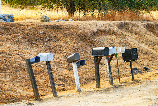 American mailboxes along roads, freeways on the side of the road.