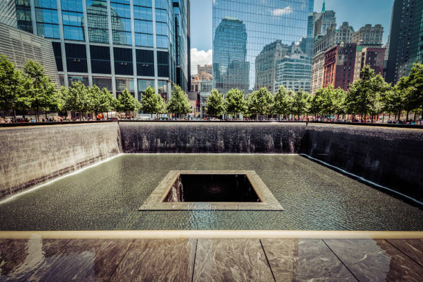 911 Memorial New York City, New York – June 29: Visitors gaze at the National September 11 Memorial & Museum on June 29, 2018 in New York City. 2001 stock pictures, royalty-free photos & images