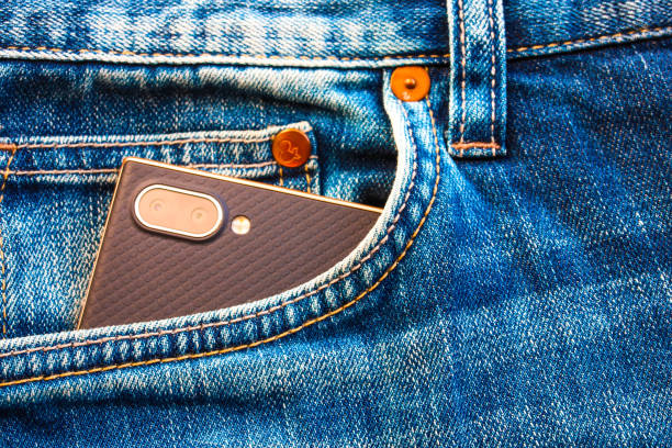 istock Smartphone with camera in blue jeans pocket. 1132193551