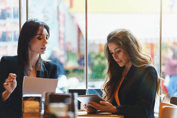 istock Modern business people working at a cafe 1132197462