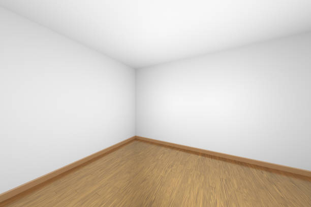 istock White empty room corner with brown wood parquet floor 1132201408