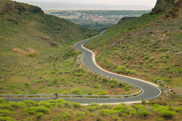 istock Cyclist on a serpentine mountain road 1132205550