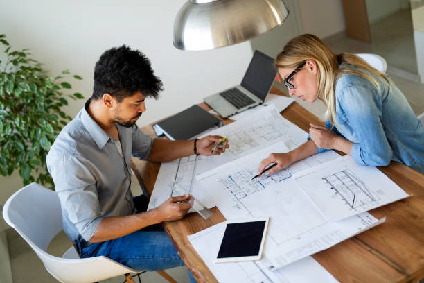 istock Coworkers working at business office and using tablet 1132205598