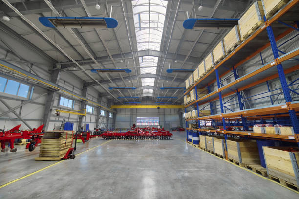 istock Large, spacious assembly shop. High storage racks with wooden boxes 1132205888