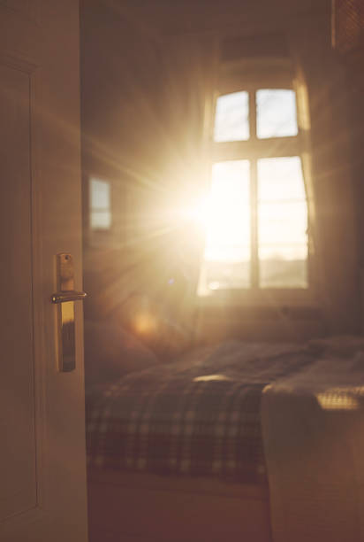 istock View into the sunny bedroom in the back light 1132208888