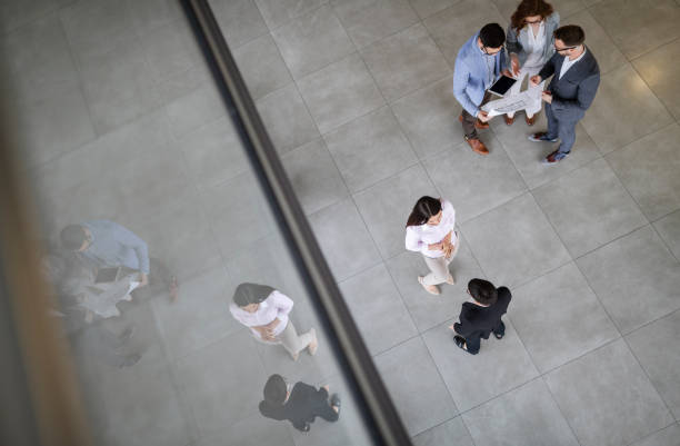 istock Business people working together in office hall. 1132209159