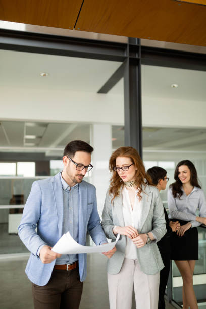 istock Group of architects and business people working together 1132209197