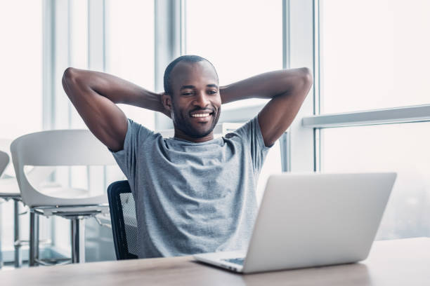 istock Young businessman working on his laptop in spacious bright office. 1132210644