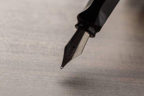 istock Black fountain pen on table 1132211707