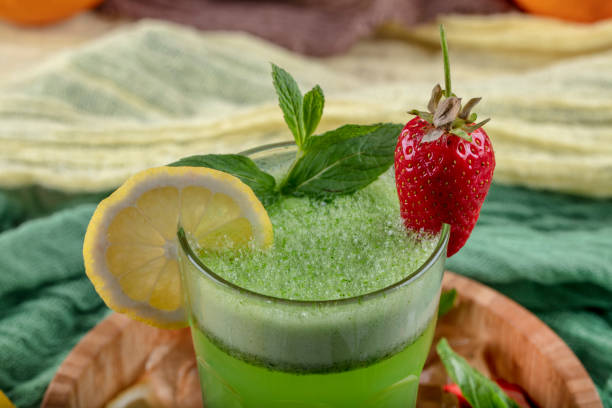 istock Lemonade with kiwi, green basil, grapefruit syrup and ice, selective focus. 1132212019