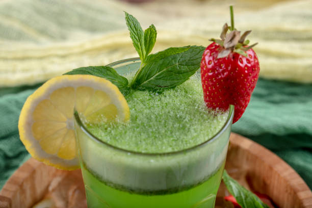 istock Lemonade with kiwi, green basil, grapefruit syrup and ice, selective focus. 1132212104