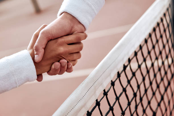 istock Two tennis players are shaking hands 1132212999