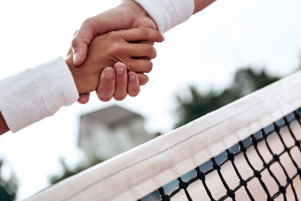istock Respect. Tennis players are shaking hands 1132213021