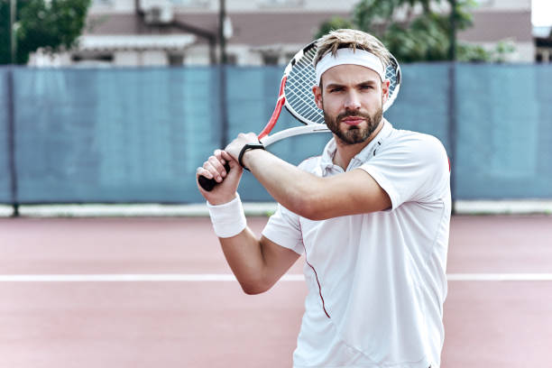 istock Concentration. Handsome man is playing tennis 1132213084