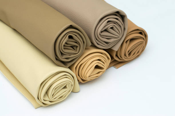 istock Leather rolls stack of brown color shades on white background 1132213347