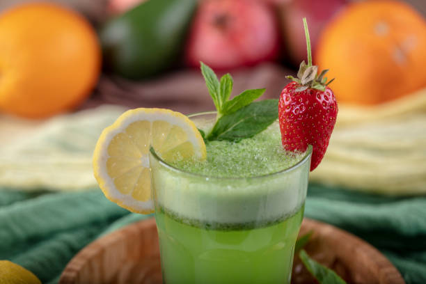 istock Lemonade with kiwi, green basil, grapefruit syrup and ice, selective focus. 1132213359