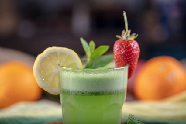 istock Lemonade with kiwi, green basil, grapefruit syrup and ice, selective focus. 1132214487
