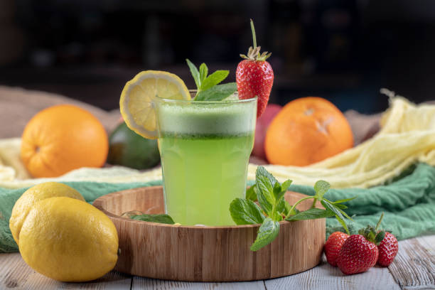 istock Lemonade with kiwi, green basil, grapefruit syrup and ice, selective focus. 1132214683