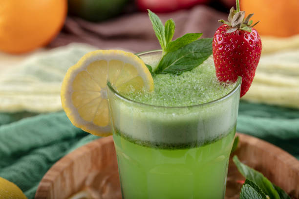 istock Lemonade with kiwi, green basil, grapefruit syrup and ice, selective focus. 1132214799
