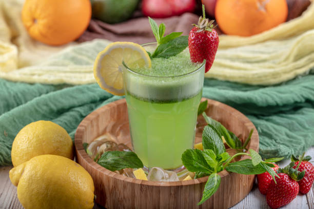 istock Lemonade with kiwi, green basil, grapefruit syrup and ice, selective focus. 1132214931