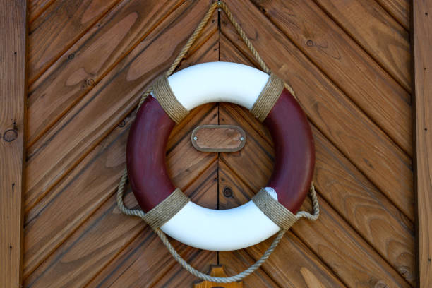 View from the ferry towards Schiermonnikoog island on the  waddensea with a lifebuoy on the railing.