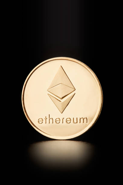 Golden Ethereum coin, cryptocurrency on black, clipping path Milan, Italy - January 30, 2018: Golden Ethereum coin, cryptocurrency on black, clipping path ethereum stock pictures, royalty-free photos & images