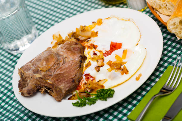 istock Image of dish of tasty cooked fried pork with  fried eggs 1132216201