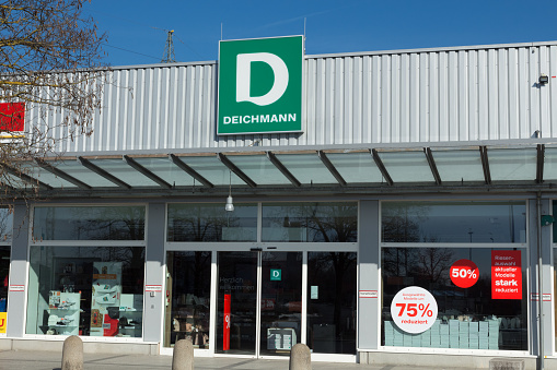 Amberg, Germany - February 17, 2019: Store of Deichmann - largest shoe retailer in Europe with seat in Essen, Germany. Sunny day with clear blue sky.