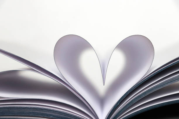 istock Book pages opened in heart shape isolated on white background 1132217783