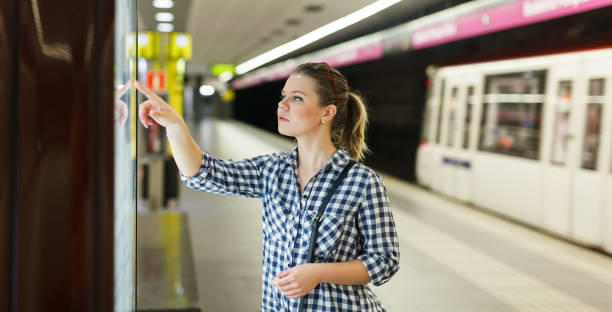 istock Woman looking at map at metro station 1132218393