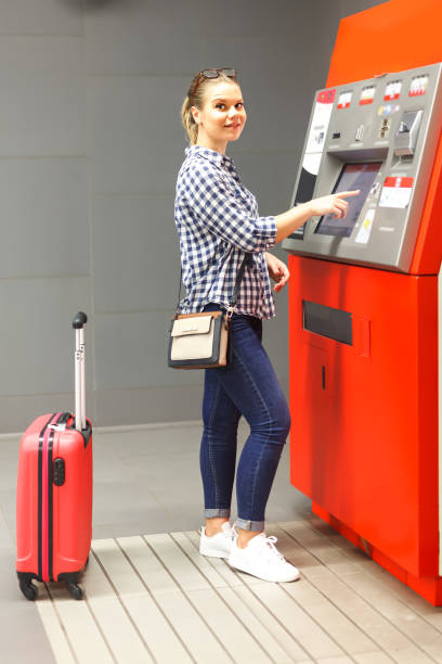 istock Nice woman buying ticket in subway 1132218397