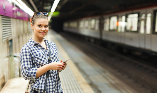 istock Woman waiting for train at subway station 1132218416