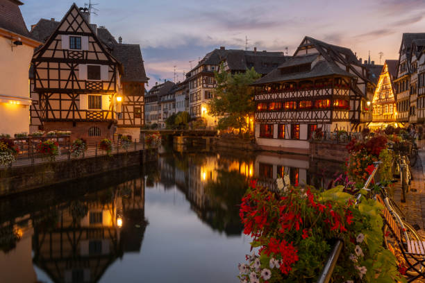 The romantic and famous district Petite France in Strasbourg Night over the colorful and famous old town in Strasbourg petite france strasbourg stock pictures, royalty-free photos & images