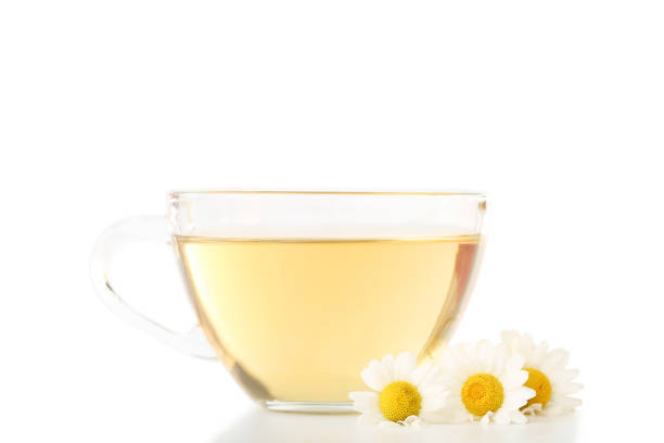 istock Cup of tea with chamomile flowers on white background 1132218603