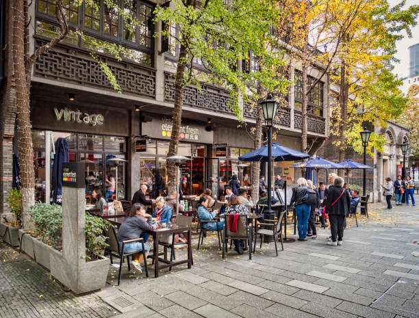 Shanghai China Pavement Cafe Xintiandi 30 November 2018: Shanghai, China - Pavement cafe in the Xintiandi area of Shanghai, now an important shopping and leisure centre. prc stock pictures, royalty-free photos & images
