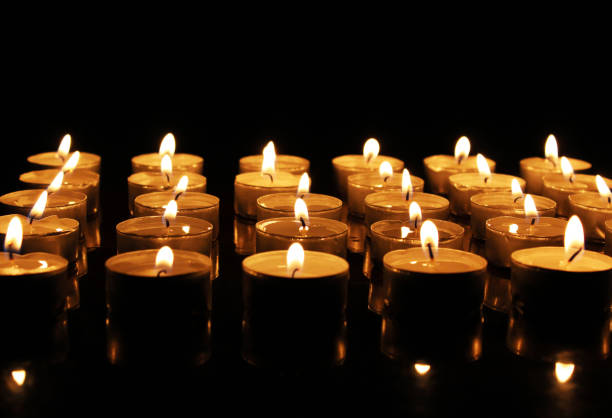 istock Many burning candles in the dark 1132219213