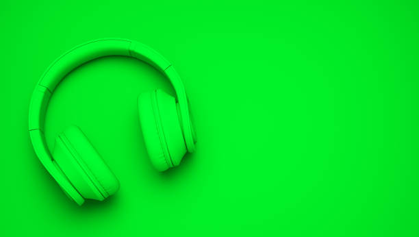 istock green wireless headphones isolated on green background 1132219925