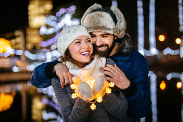 istock Young couple having a romantic moment outdoors at night 1132220731