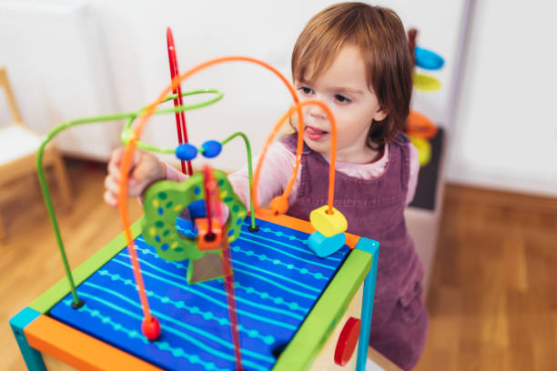 istock Cute child playing on table indoor 1132221226