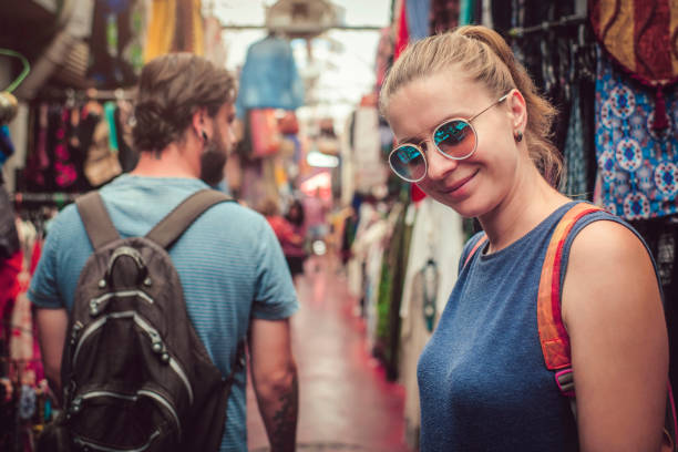 istock Young happy couple discovers gifts market while travelling 1132223719