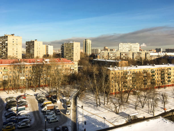 Houses and cars in winter snowy Moscow